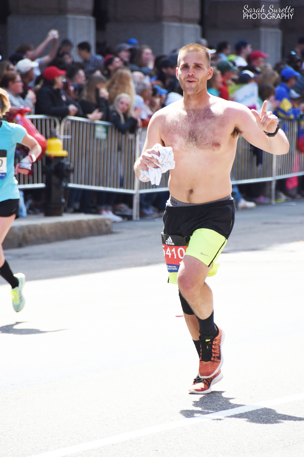 Allan running down Boylston on his way to the finish line!