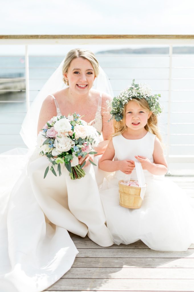Bridal portrait with flower girl for coastal wedding 