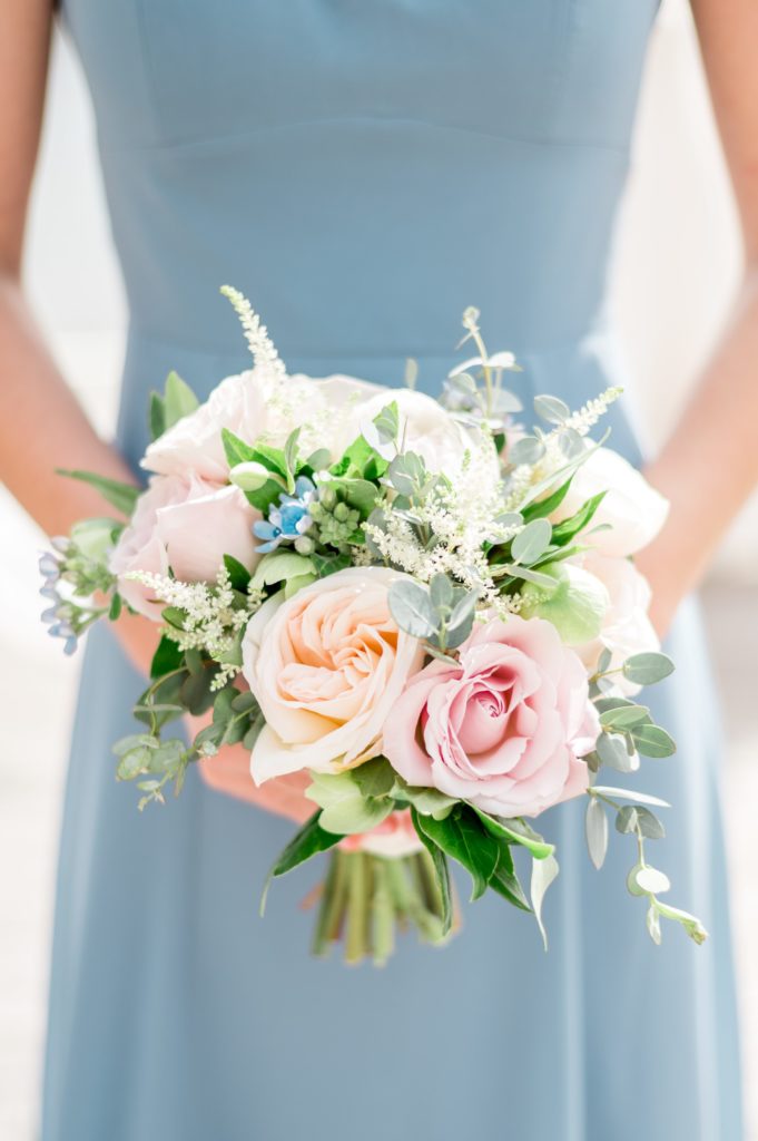 Stunning bridesmaid bouquet with pink roses and touches of blue