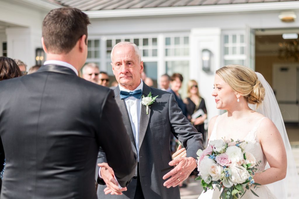 Bride walking down the aisle with her dad at the Beauport Hotel 