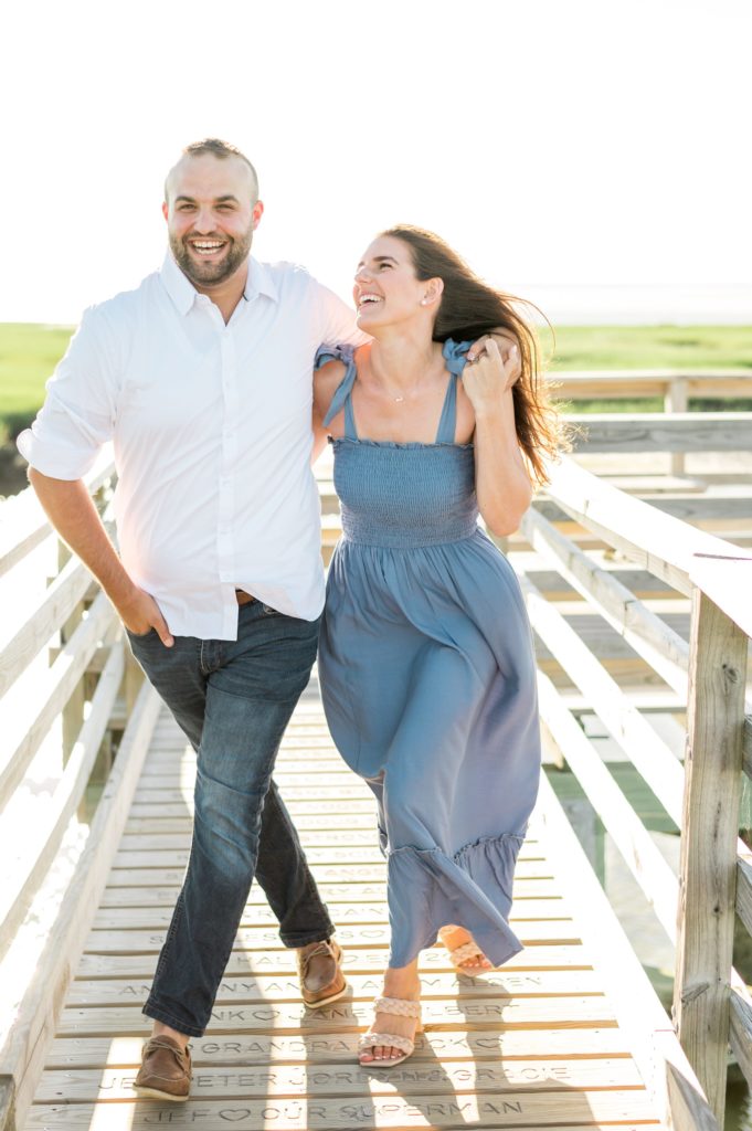 Couple posing on the boardwalk at Gray's beach on Cape Cod