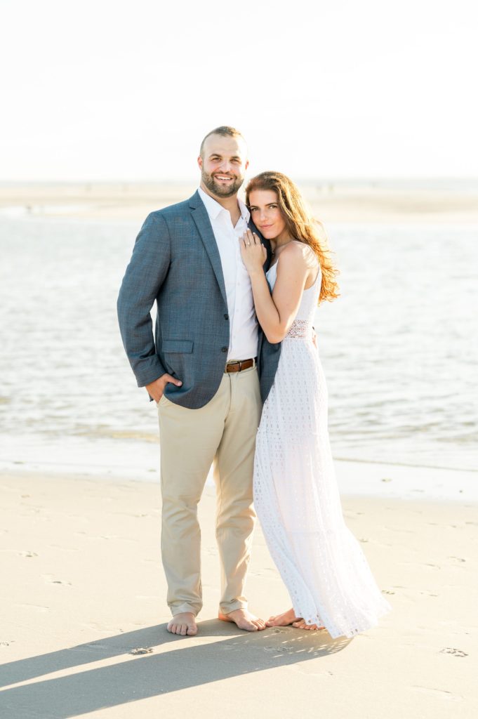 Couple posing on the beach for Cape Cod beach engagement session