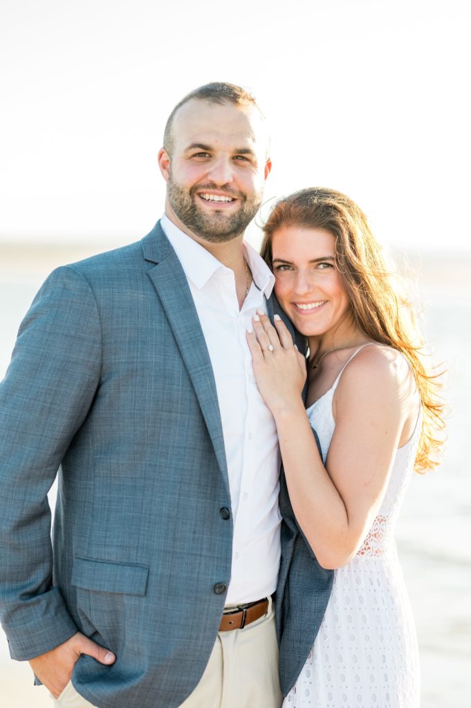 Couple posing on the beach for Cape Cod beach engagement session