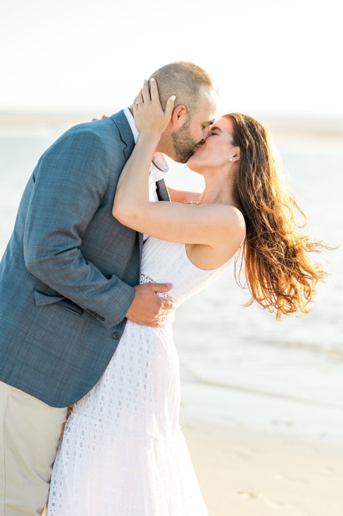 couple kissing on the beach at sunset in Dennis, MA