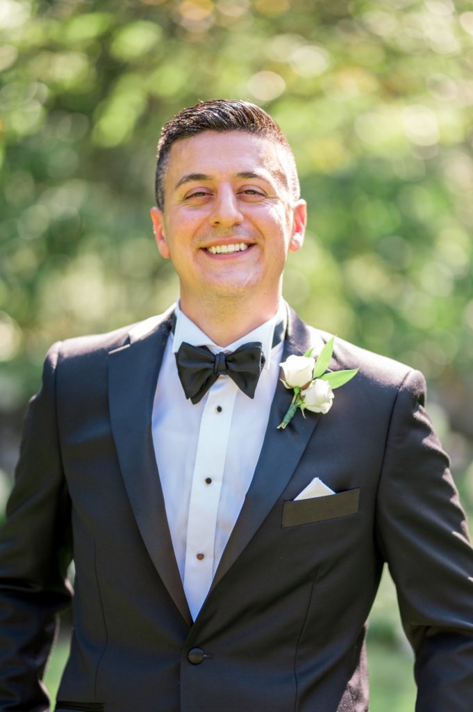 Groom portrait for outdoor summer wedding