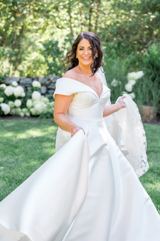 Bride twirling in her wedding dress 