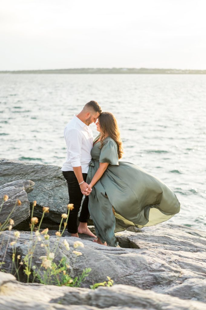 Sunset summer engagement photos on a windy day 