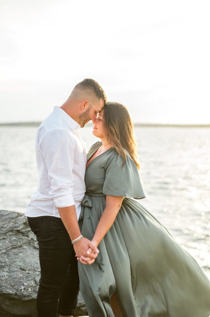 Sunset summer engagement photos on a windy day 