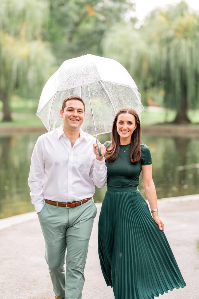 Couple holding a bubble umbrella during engagement photos 