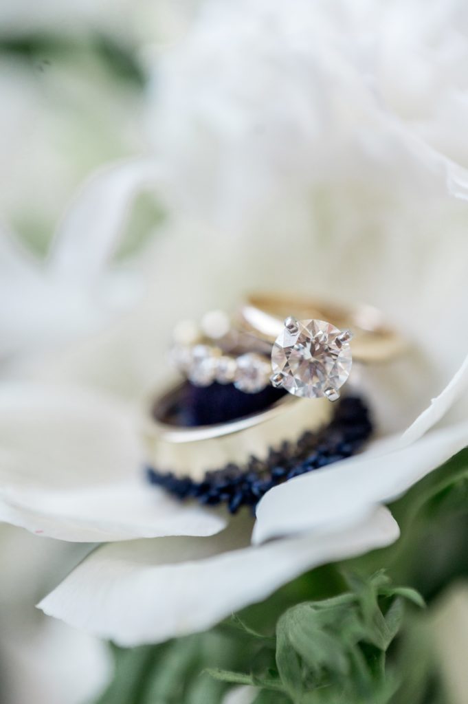 Detail photography of wedding bands and engagement ring