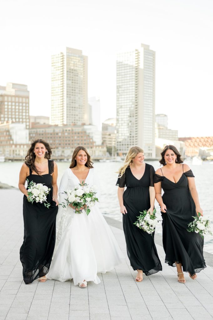 Bride walking with bridesmaids for Davio's Seaport Boston Fall Wedding