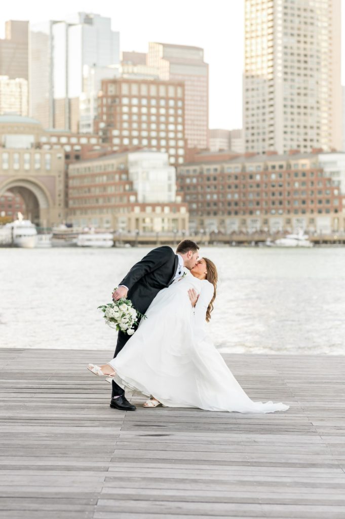 Bride and groom wedding portrait dip kiss for Davio's Seaport Boston Fall Wedding