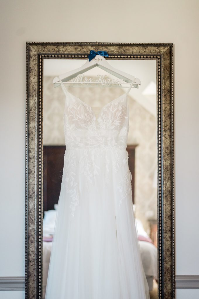 Wedding dress hanging on the mirror at The Groton Inn