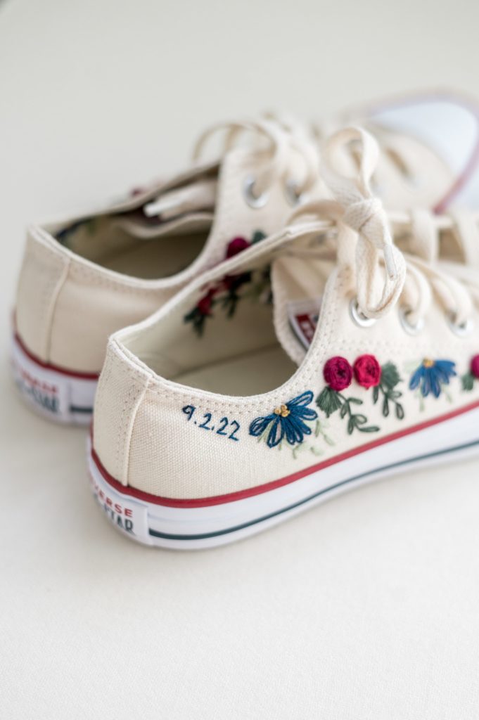 Bride's custom embroidered converse sneakers for summer wedding reception