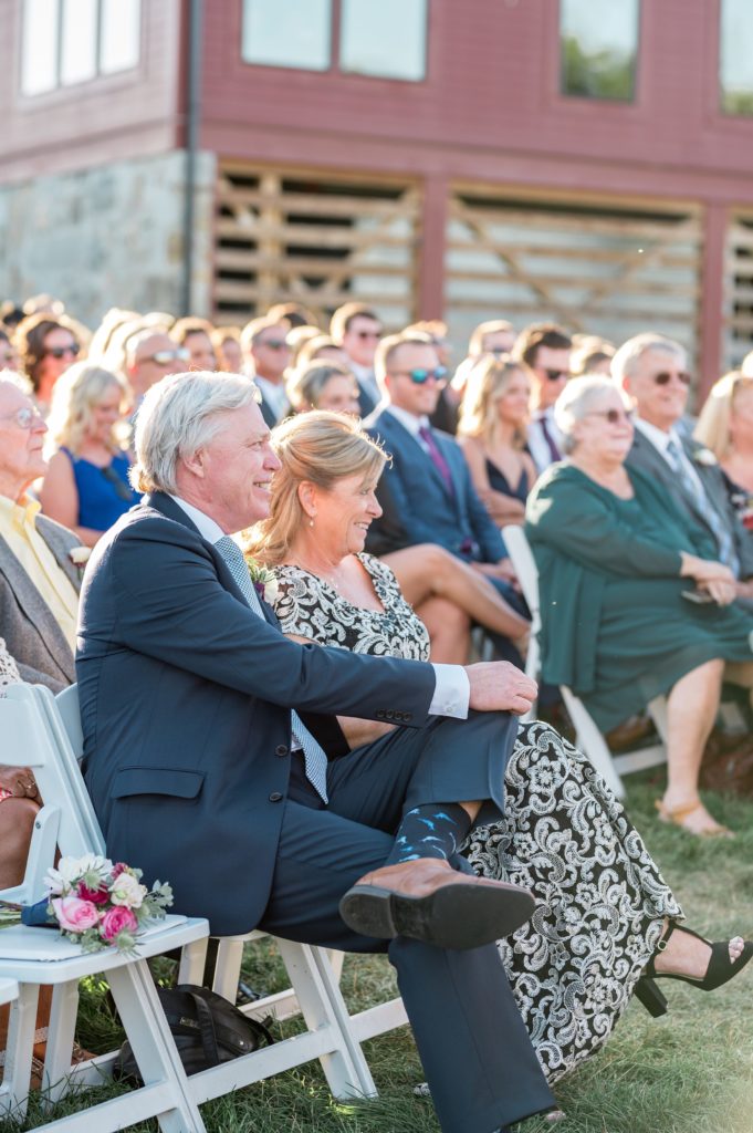 Parents of the groom during outdoor ceremony at Gibbet Hill in Groton, MA
