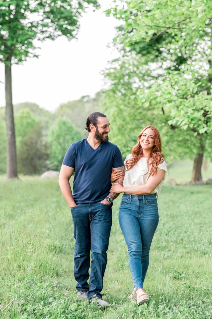 Couple walking together during engagement session