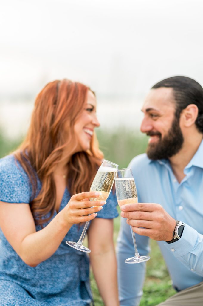 Engagement session champagne toast in Hingham, MA