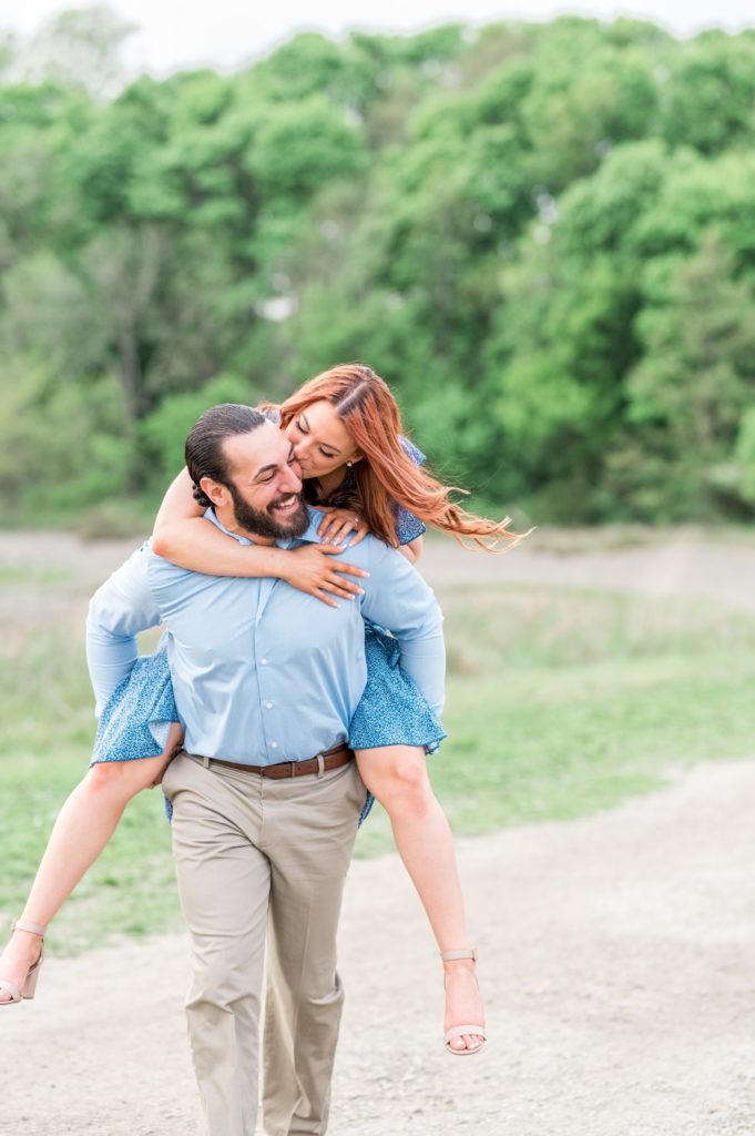 Couple piggyback ride for engagement session
