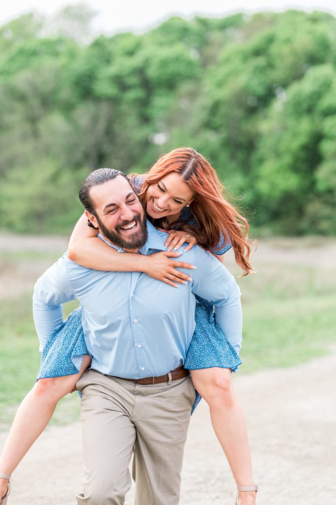 Couple piggyback ride for engagement session 