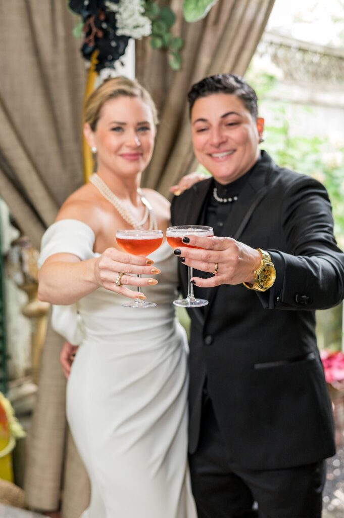 Couple with Cocktails for Strangers & Saints wedding 