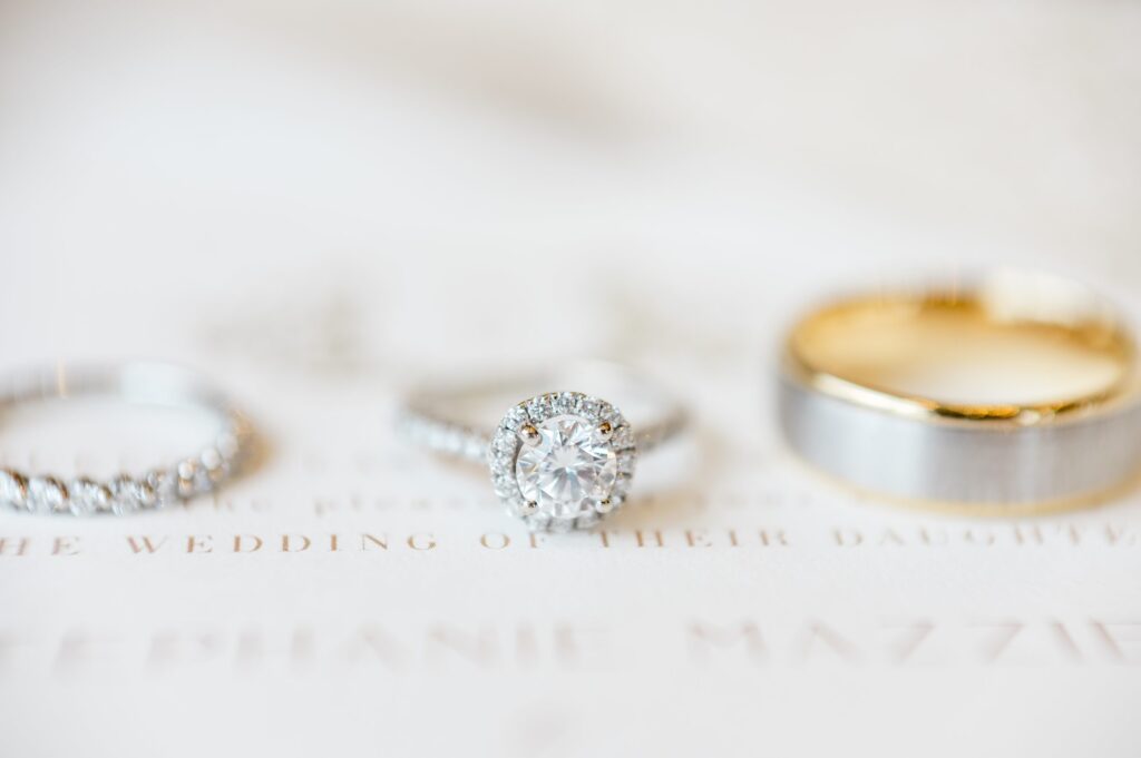 Detail photography of engagement ring and wedding band 