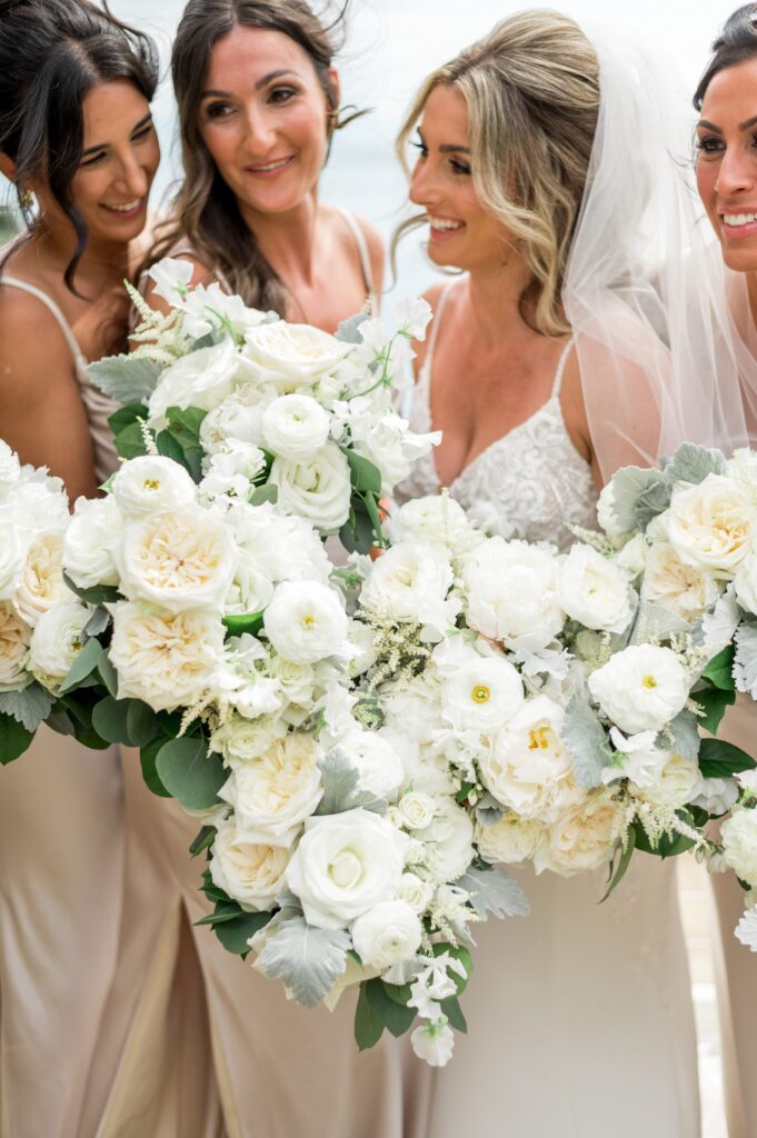 Bride and bridesmaid bouquets with champagne silk dresses for North Shore wedding