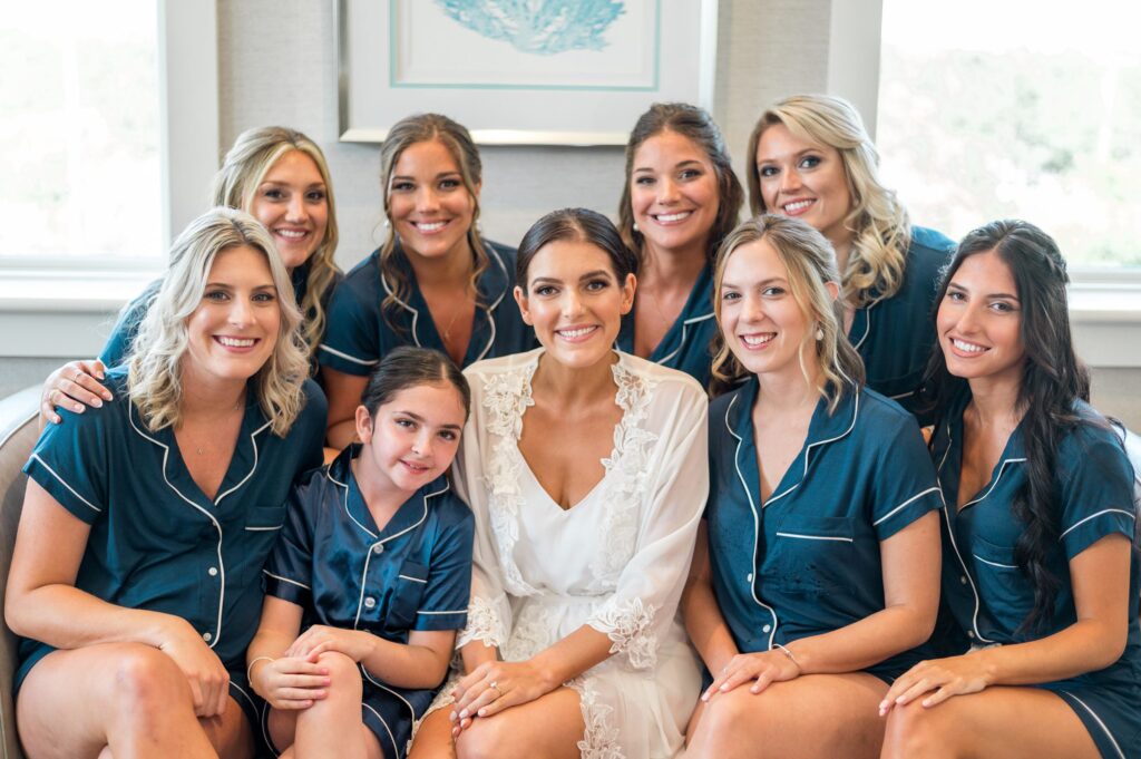 Bride and bridesmaids getting ready photos in matching navy PJ set