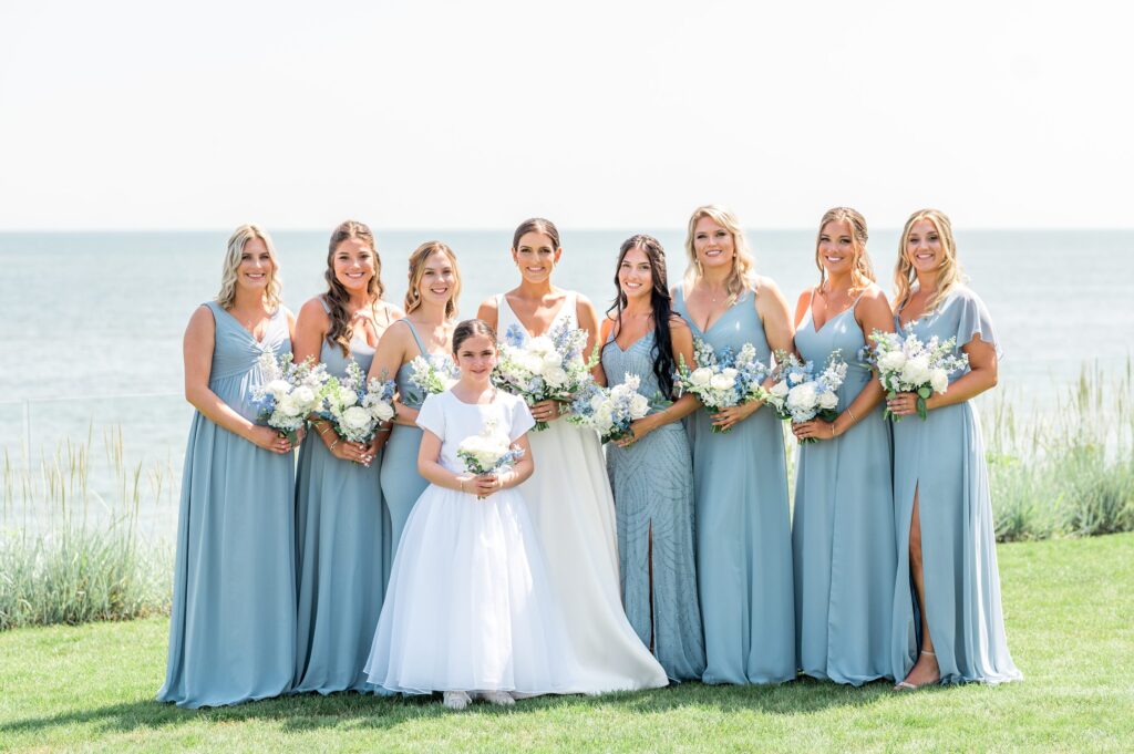 Bride and bridesmaids portrait by the ocean for Pelham House Resort wedding
