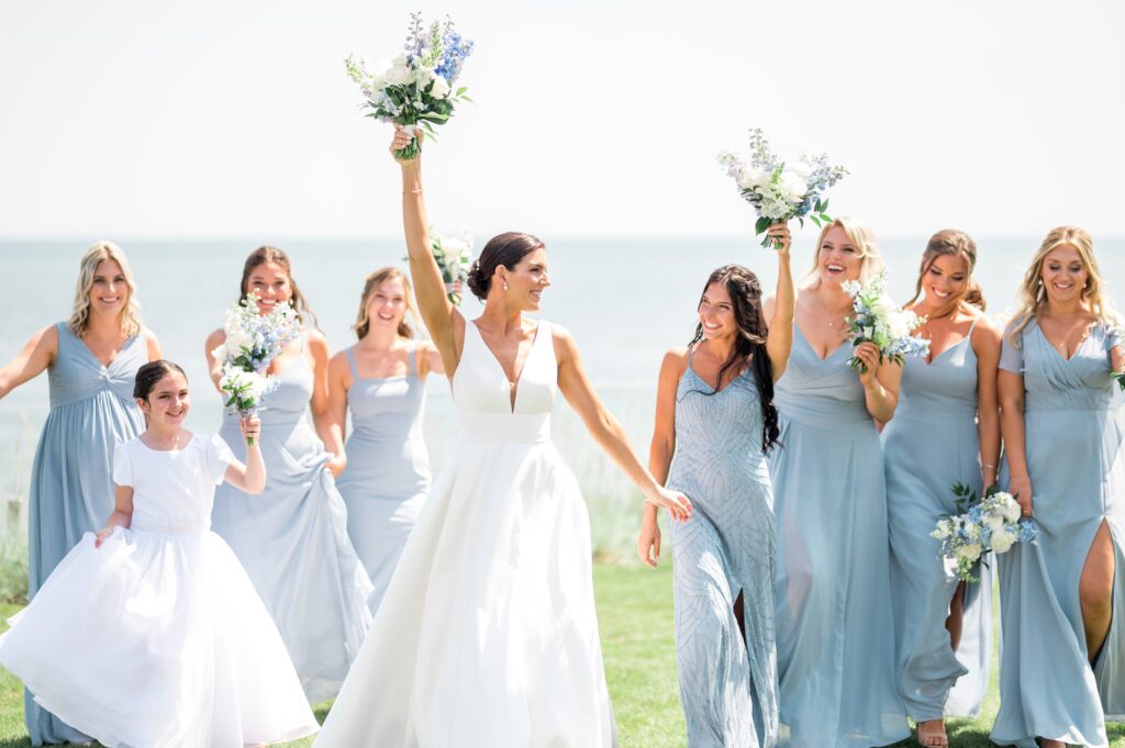 Bride and bridesmaids portrait by the ocean for Pelham House Resort wedding