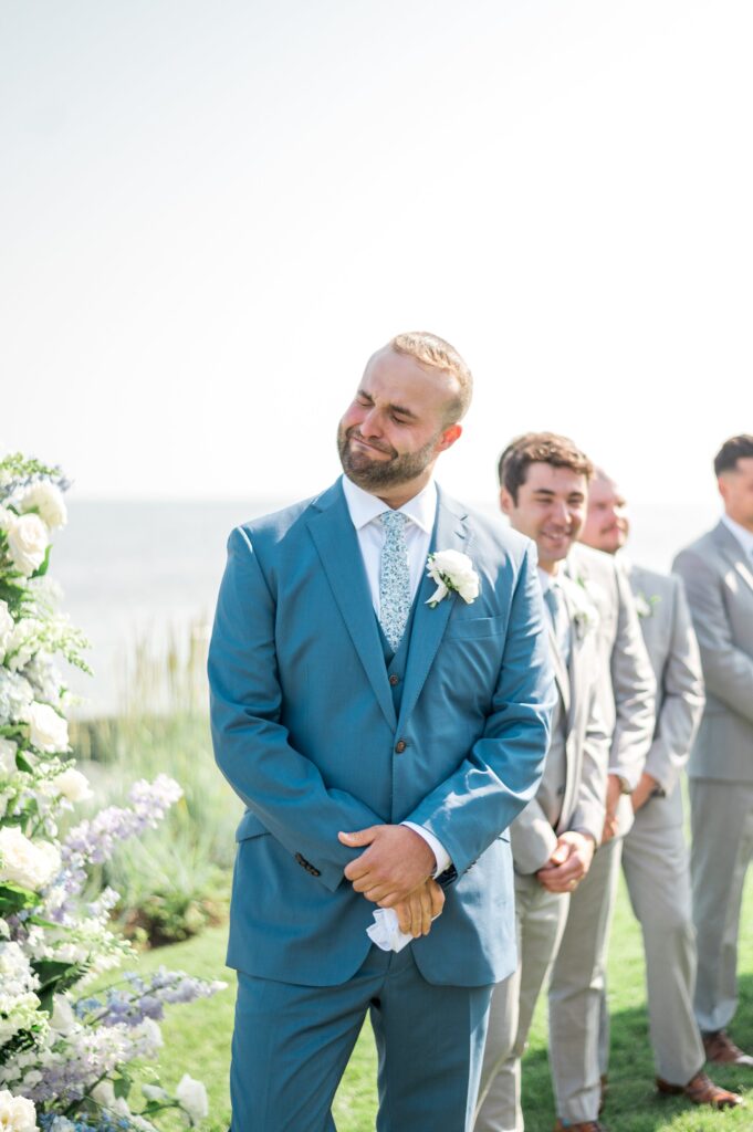 Grooms emotional reaction to seeing bride walk down the aisle at Cape Cod wedding