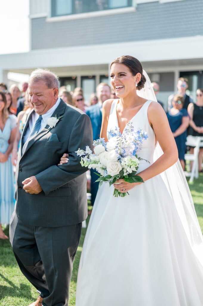 Bride and her father walking down the aisle at the Pelham House Resort