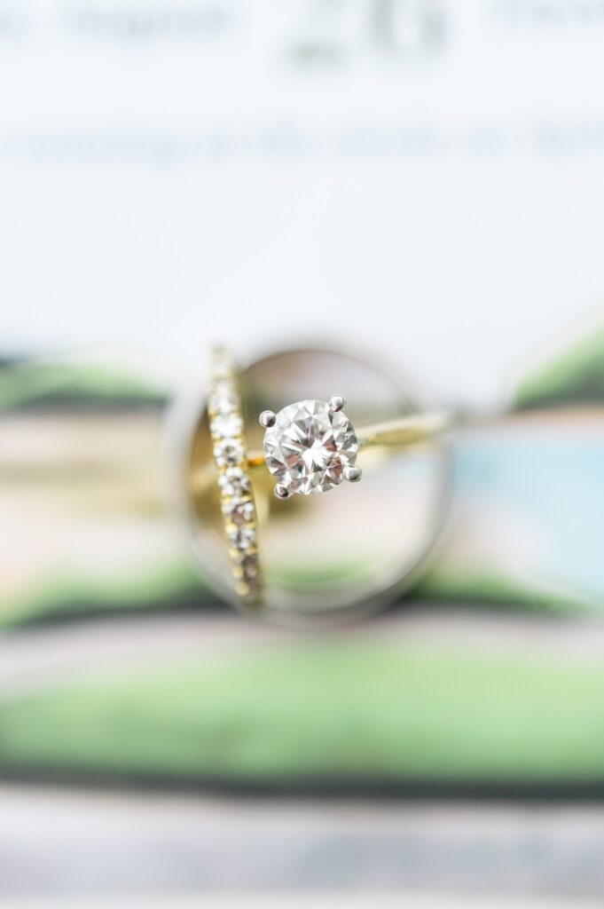 Engagement ring and and wedding band detail photography