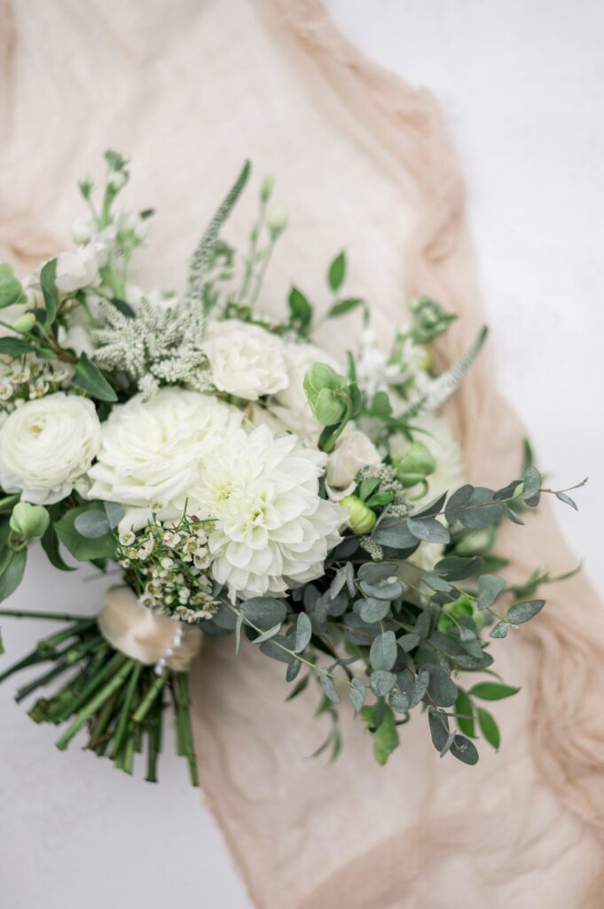 White and green bridal bouquet for Cape Cod tented wedding