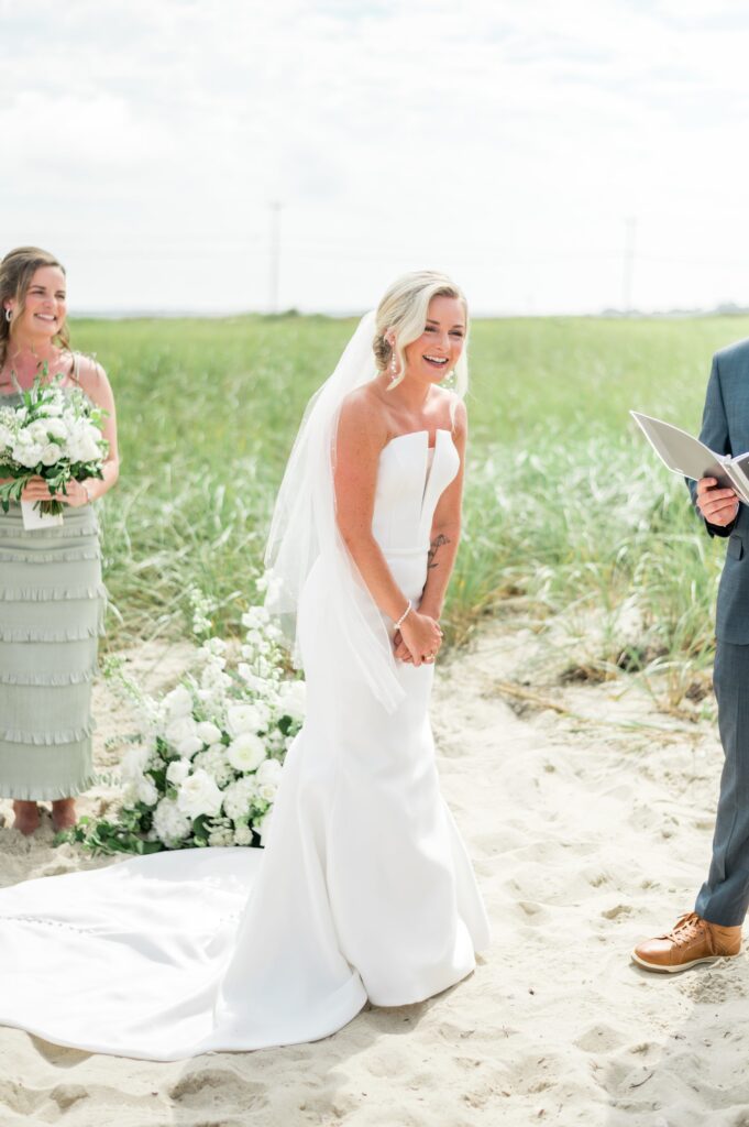 Bride during wedding beach wedding ceremony on the sand on Cape Cod