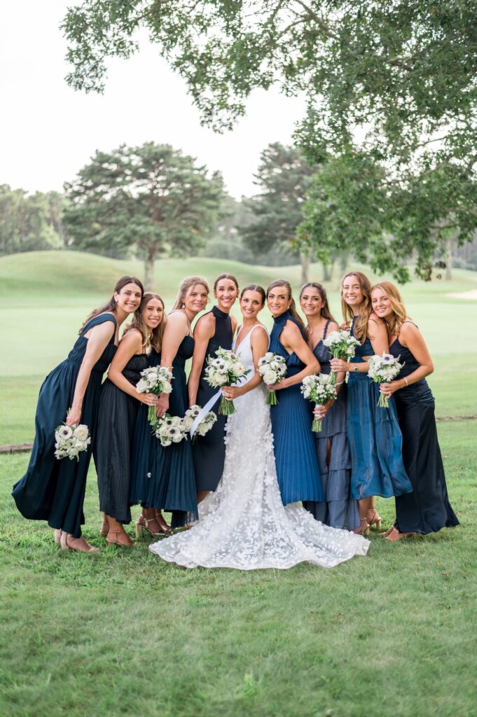 Bridesmaids mismatched navy blue dresses and white bouquets for Martha's Vineyard wedding