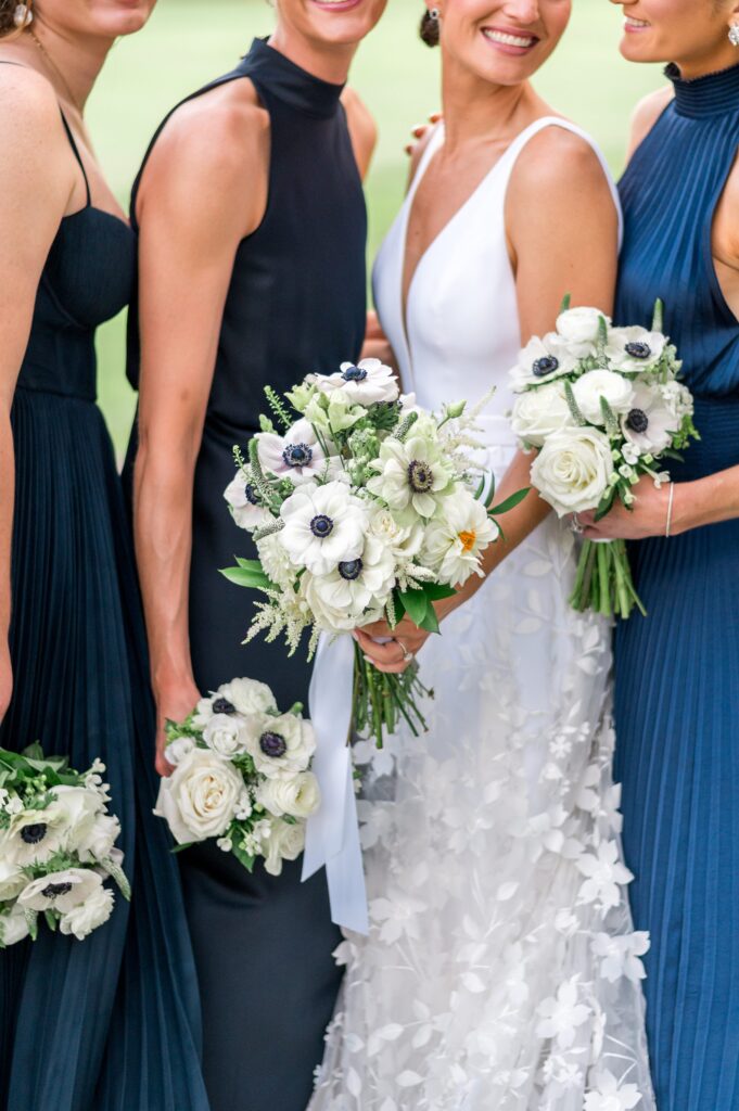 Bridesmaids mismatched navy blue dresses and white bouquets for Martha's Vineyard wedding