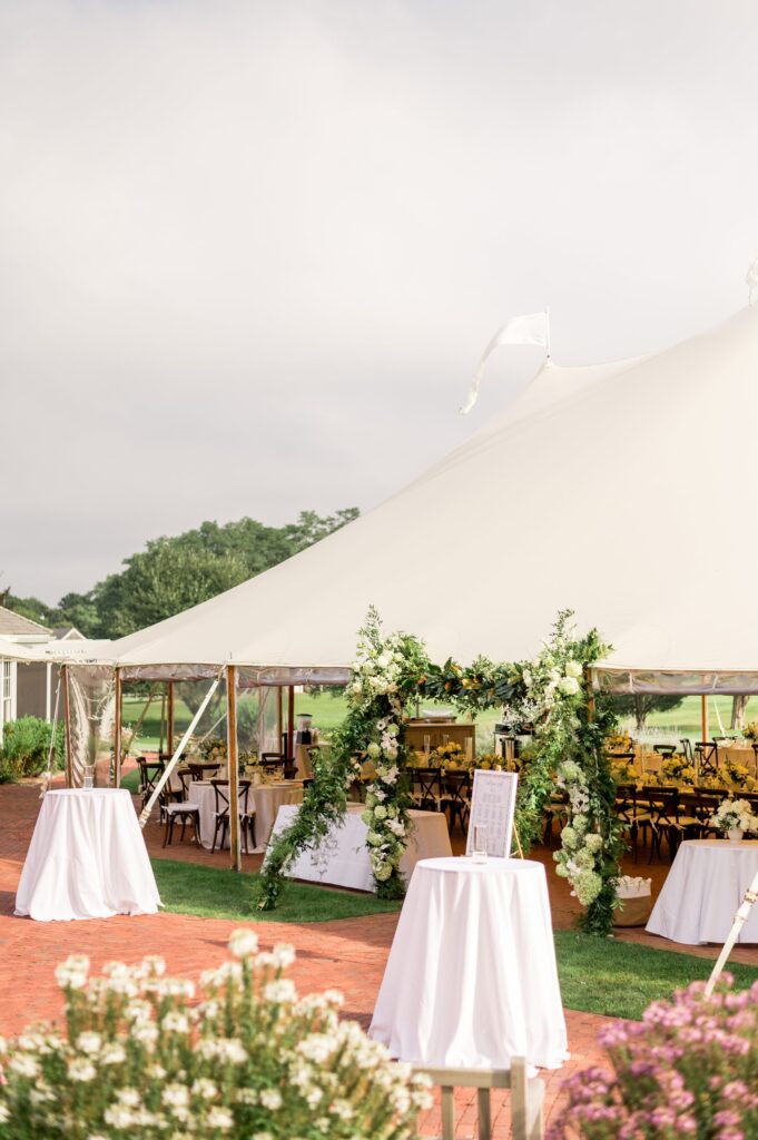 New England tented wedding reception with floral entrance at Farm Neck Golf Club Martha's Vineyard Wedding