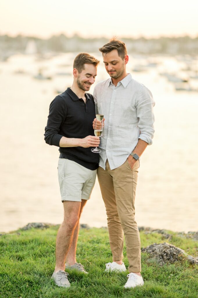 Couple cheersing with champagne  during engagement photos 