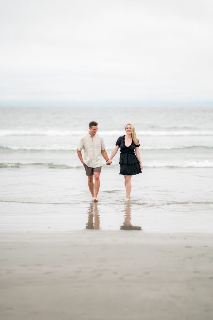 Newport Engagement session at Second Beach with couple holding hands 