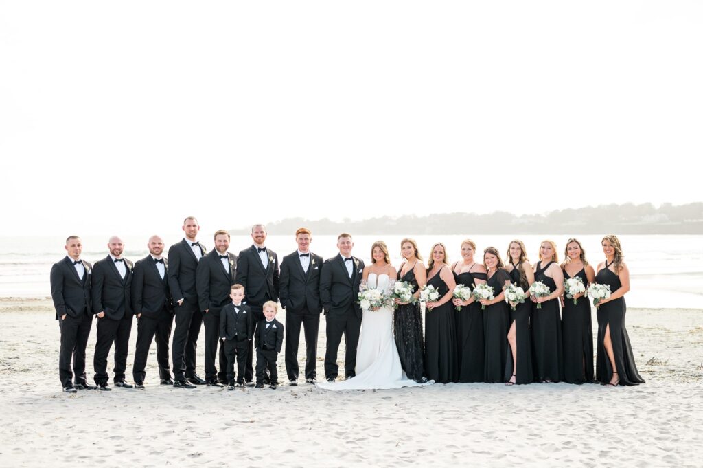 Wedding party portrait wearing all black and tuxes for Newport wedding
