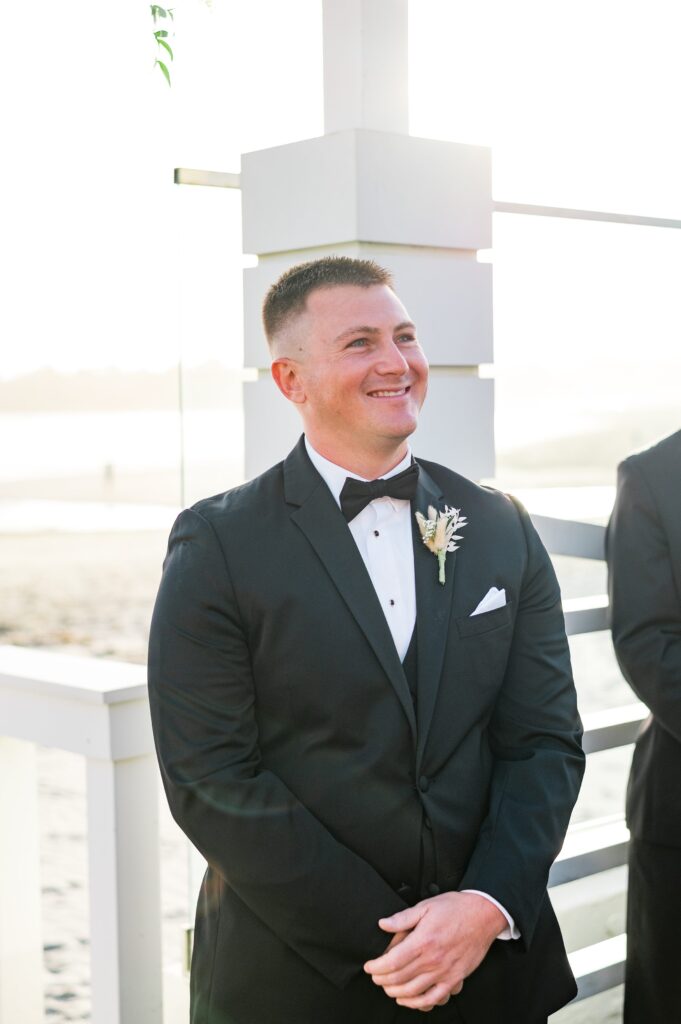 Groom's reaction to seeing bride walk down the aisle 