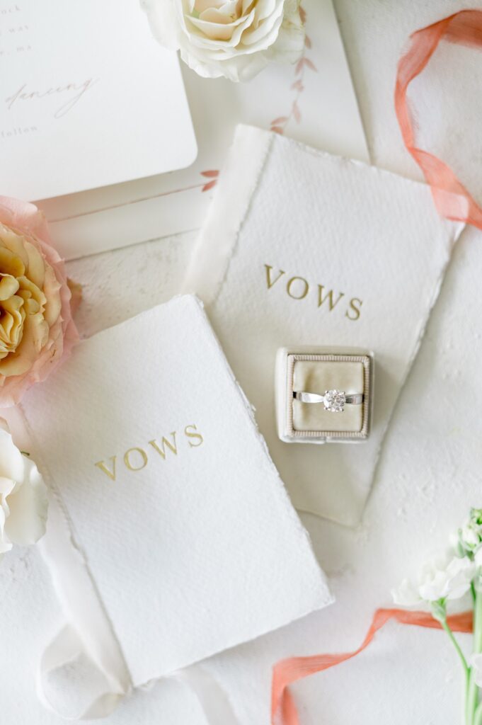 Detail photography of engagement ring and vows book for New England wedding