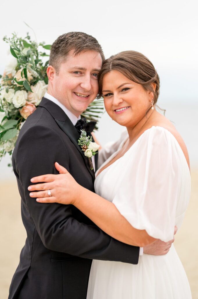 Bride and groom wedding day photography on the beach 