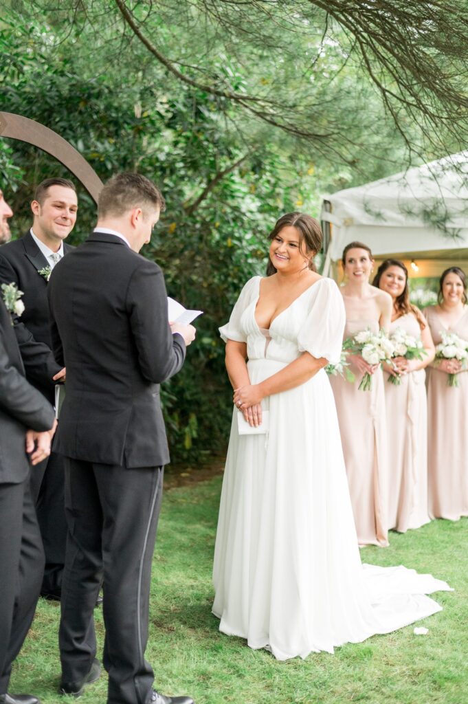 Bride and groom sharing personal vows during wedding ceremony 