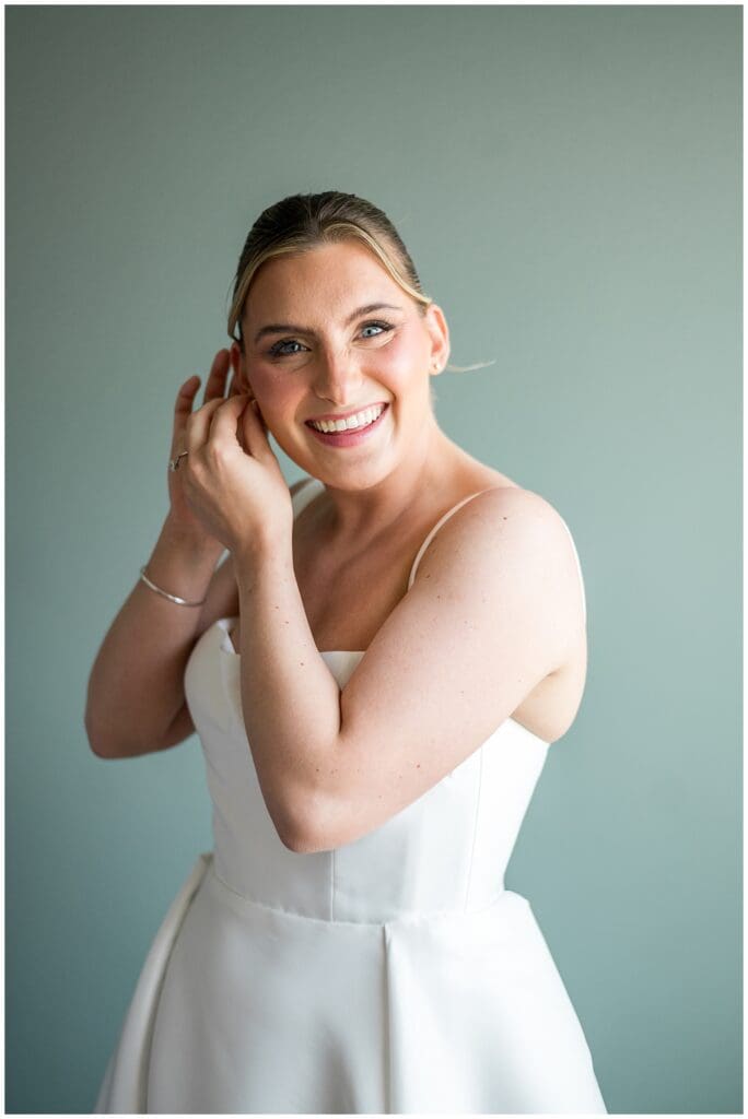 Newport Bride Putting earrings in at the Atlantic Resort