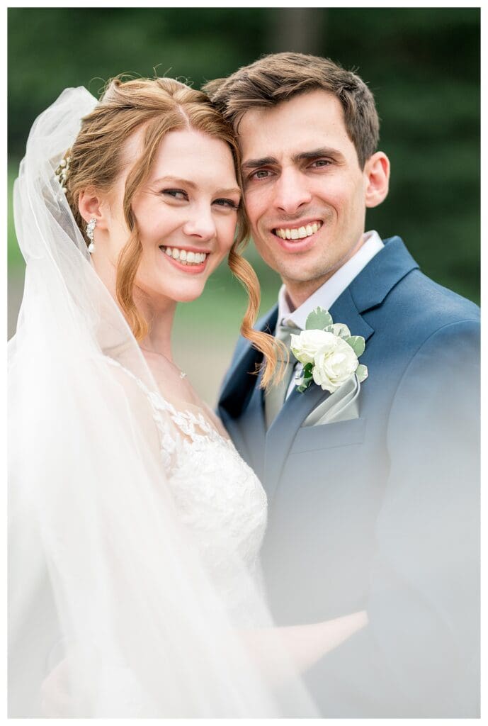 Close-up of the couple smiling with their heads touching