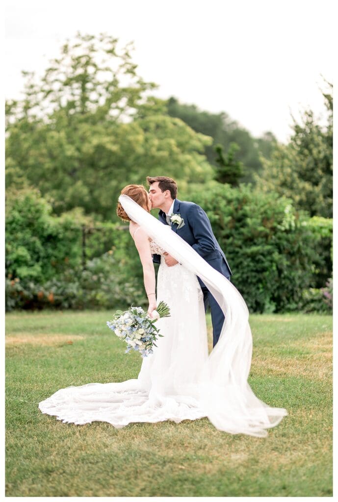 Bride and groom sharing a dip kiss