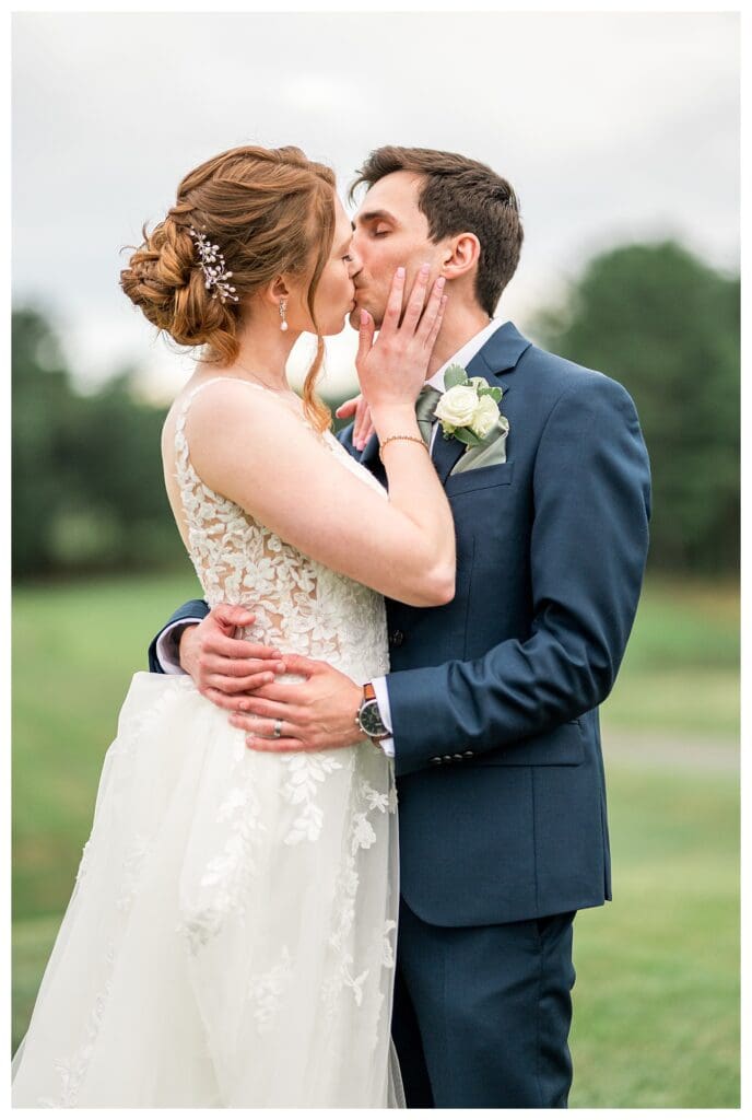 Bride and groom share a romantic kiss