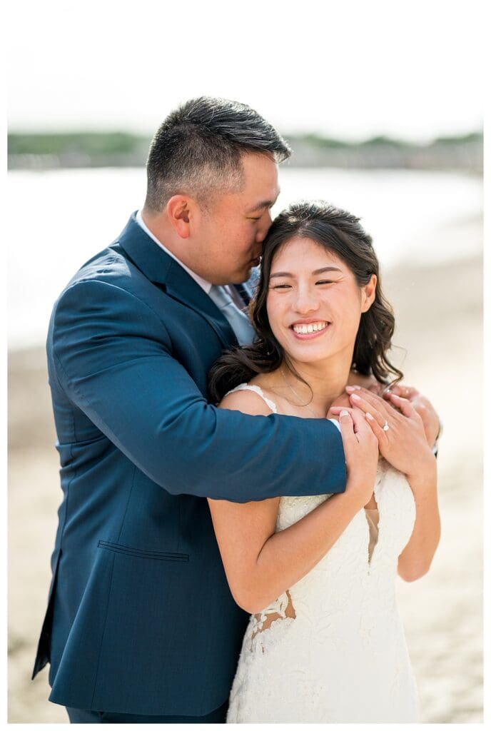 Beauport Wedding Photography: Romantic newlywed portrait with the ocean as a backdrop, captured in bright and airy style.