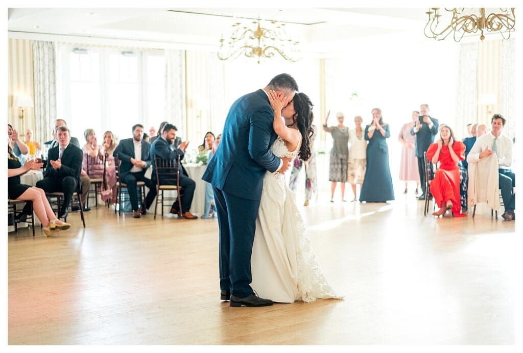 Couple sharing a first dance moment  at a New England seaside wedding.
